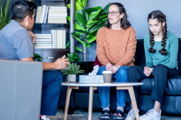 Mom and daughter at a session with a therapist